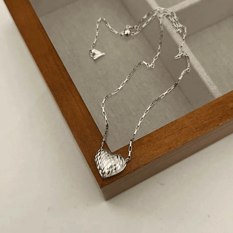 Detailed view of the Sterling Silver Elegant Heart Necklace chain and pendant