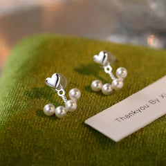 Close-up detail of the sparkling zircons and plating on the Star Tassel Earrings