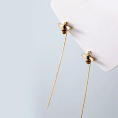 Model showcasing the dangle and style of the Sterling Silver Elegant Simple Little Bee Threader Earrings