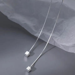 Close-up detail of the sparkling zircons and plating on the Square Threader Earrings