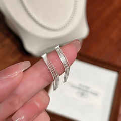 Angled view of the Sterling Silver Elegant Tassel Earrings