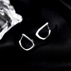 Close-up detail of the sparkling zircons and plating on the Twisted Geometric Earrings