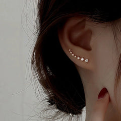 Close-up detail of the sparkling zircons and plating on the Zircon Crawler Earrings