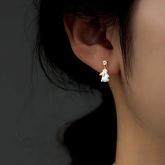 Model showcasing the dangle and style of the Sterling Silver Elegant Zircon Diamond Little Rabbit Earrings