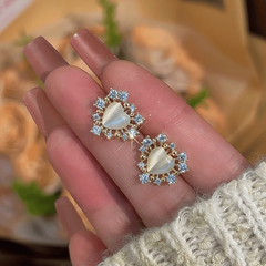 Angled view of the 14K Gold-Plated Elegant Zircon Heart Stud Earrings