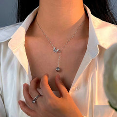 Close-up of the pendant and clasp on the Butterfly Pearl Necklace