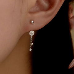 Model showcasing the dangle and style of the Sterling Silver Flower Screw Tassel Earrings