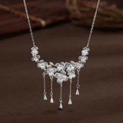 Close-up of the pendant and clasp on the Flower Drop Necklace