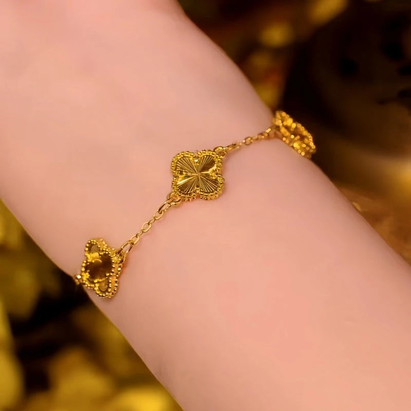 Close-up of the clasp and charm details on the Clover Bracelet