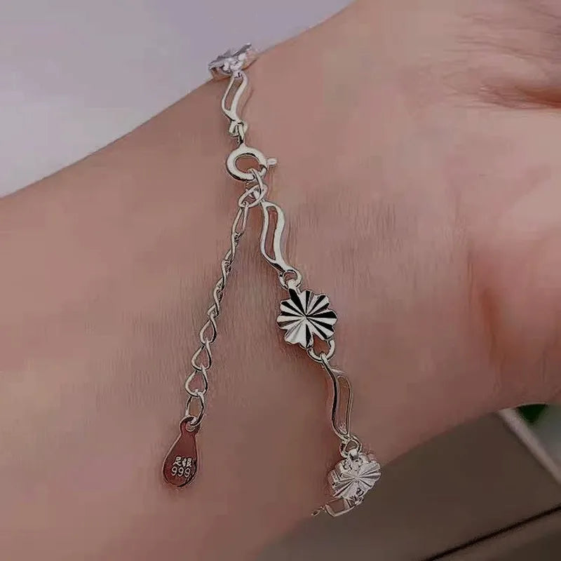 Model wearing the Sterling Silver Four-Leaf Clover Bracelets to highlight its design on the wrist