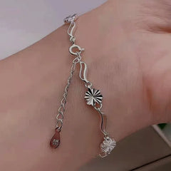 Model wearing the Sterling Silver Four-Leaf Clover Bracelets to highlight its design on the wrist