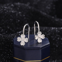 Model showcasing the dangle and style of the Sterling Silver Four-Leaf Flower Ear Hooks