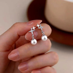 Close-up detail of the sparkling zircons and plating on the Star Pearl Earrings