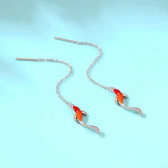 Close-up detail of the sparkling zircons and plating on the Goldfish Threader Earrings