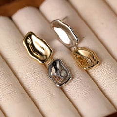 Angled view of the Sterling Silver Golden And Silver Drop Earrings