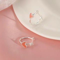 Close-up detail of the sparkling zircons and plating on the Heart Hoop Earrings