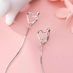Angled view of the Sterling Silver Heart Ear Clip Earrings