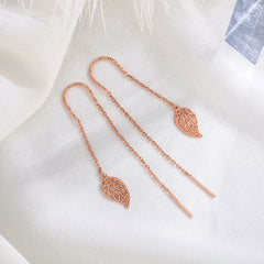 Close-up detail of the sparkling zircons and plating on the Leaf Threader Earrings