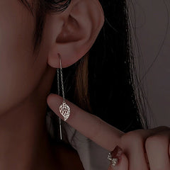 Model showcasing the dangle and style of the Sterling Silver Hollow Leaf Threader Earrings