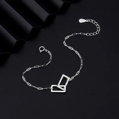 Close-up of the clasp and charm details on the Hollow Heart Earrings