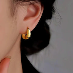 Model showcasing the dangle and style of the Sterling Silver Irregular Earrings