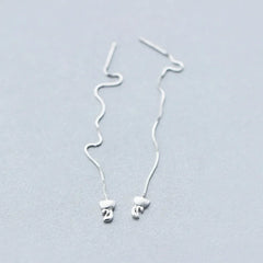 Model showcasing the dangle and style of the Sterling Silver Kitten Threader Earrings