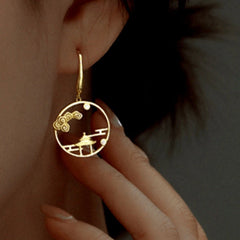 Model showcasing the dangle and style of the Sterling Silver Landscape Pavilion Ear Hook Earrings