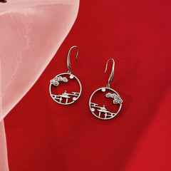 Close-up detail of the sparkling zircons and plating on the Leaf Threader Earrings