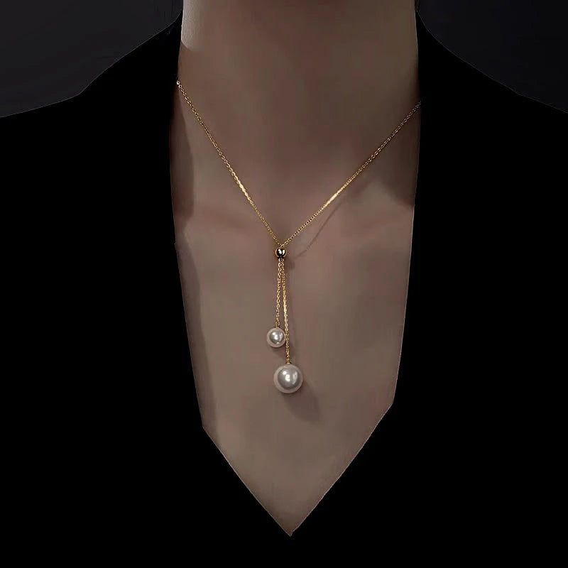 Sterling Silver Large And Small Pearl Sweater Necklaces worn to showcase its length and pendant detail