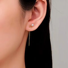 Angled view of the Sterling Silver Leaf Pearl Tassel Earrings