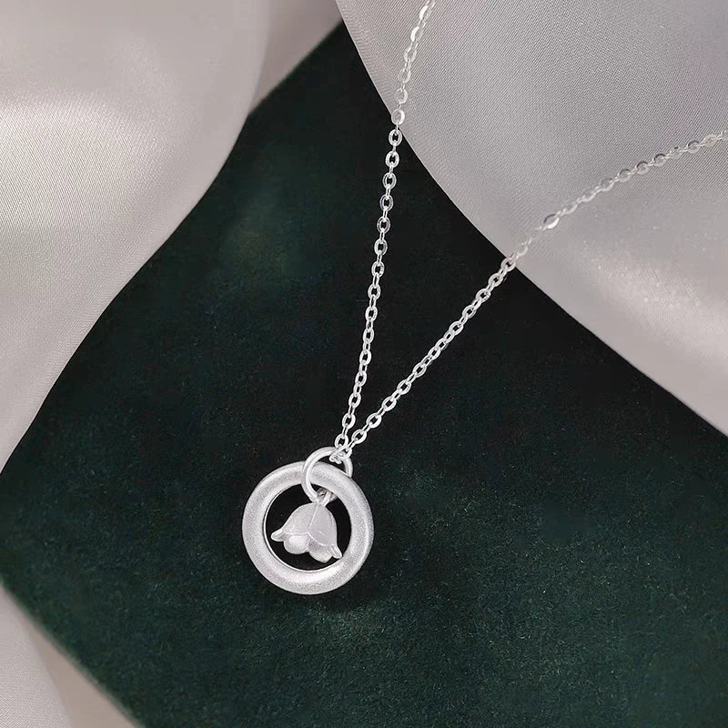 Close-up of the pendant and clasp on the Pearl Necklace