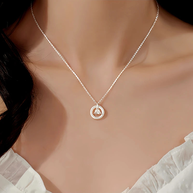 Detailed view of the Sterling Silver Lily Of The Valley Hoop Necklace chain and pendant