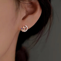 Model showcasing the dangle and style of the Sterling Silver Little Prince Stud Earrings