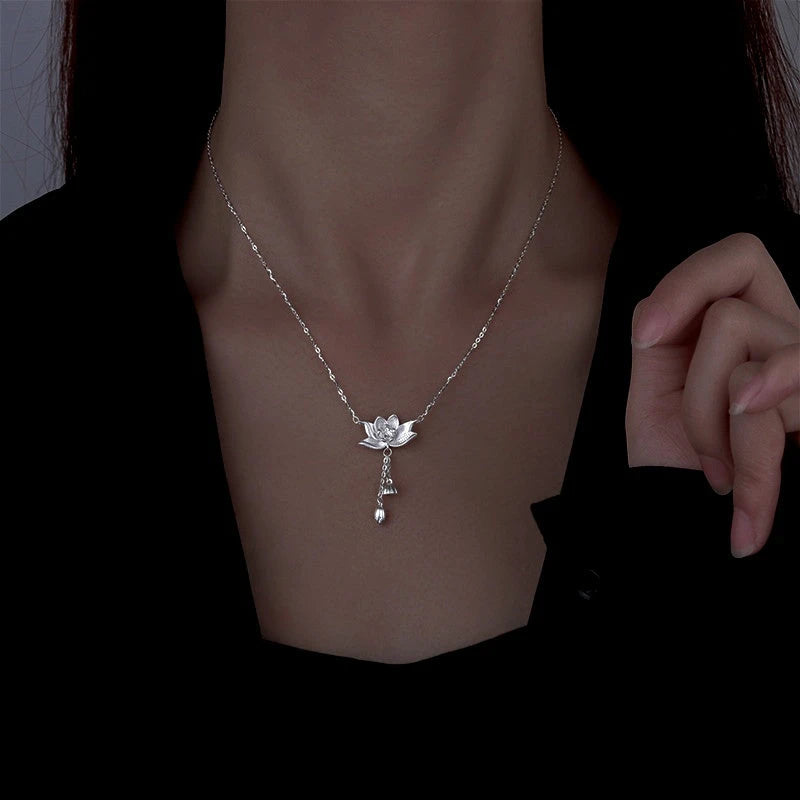 Sterling Silver Lotus Tassel Necklace worn to showcase its length and pendant detail