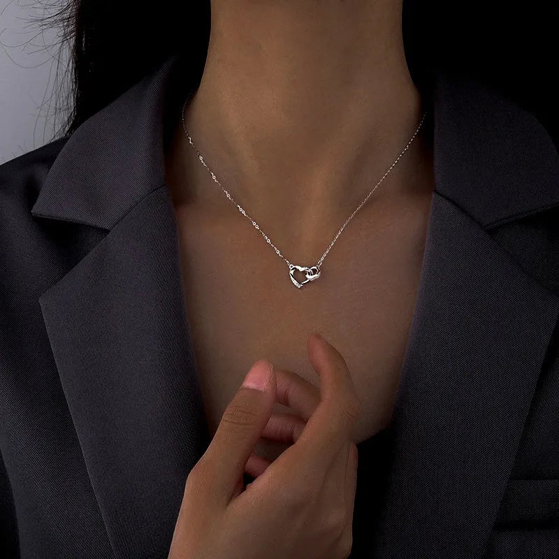 Sterling Silver Love Double Ring Necklace worn to showcase its length and pendant detail