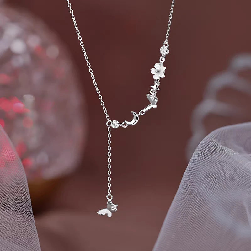 Sterling Silver Luxury Butterfly And Moon Tassel Necklace worn to showcase its length and pendant detail