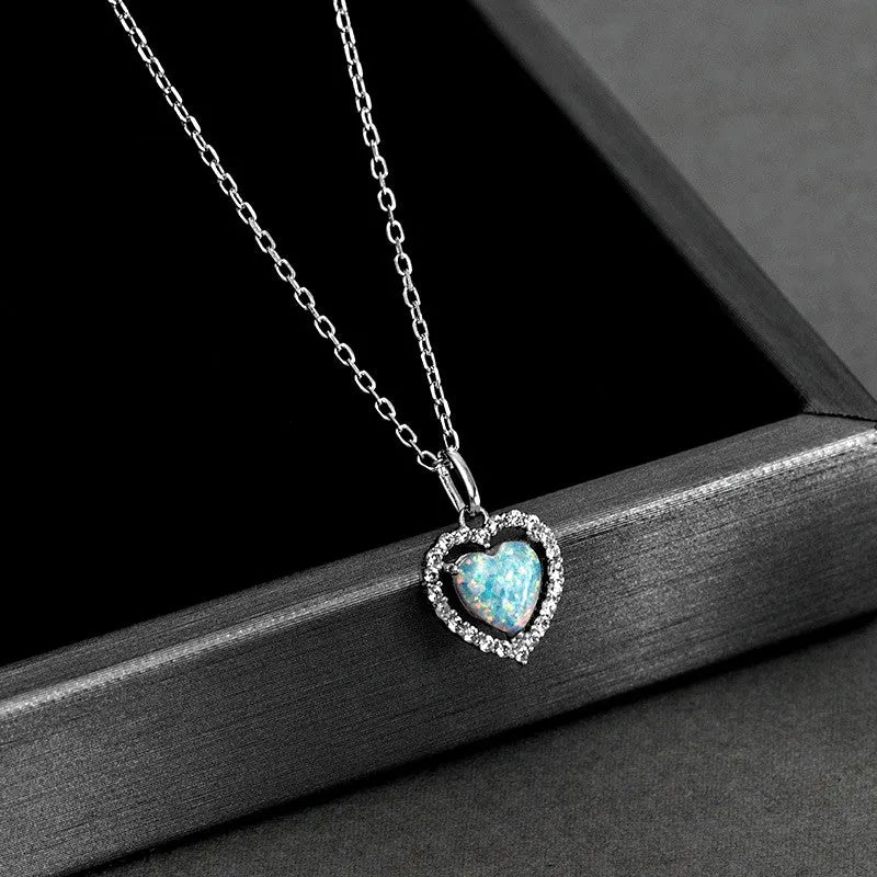 Close-up of the pendant and clasp on the Letter Threader Earrings