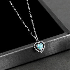 Close-up of the pendant and clasp on the Letter Threader Earrings