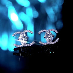 Angled view of the Sterling Silver Luxury Double C Moissanite Stud Earrings