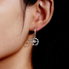Model showcasing the dangle and style of the Sterling Silver Luxury Moissanite Earrings