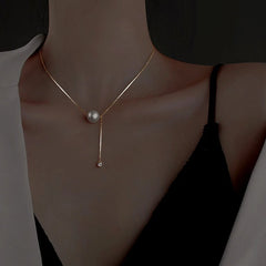 Sterling Silver Luxury Pearl Tassel Necklace worn to showcase its length and pendant detail