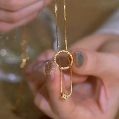 Close-up of the pendant and clasp on the Circle Pendant Necklace