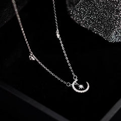 Close-up of the pendant and clasp on the Star and Moon Necklace