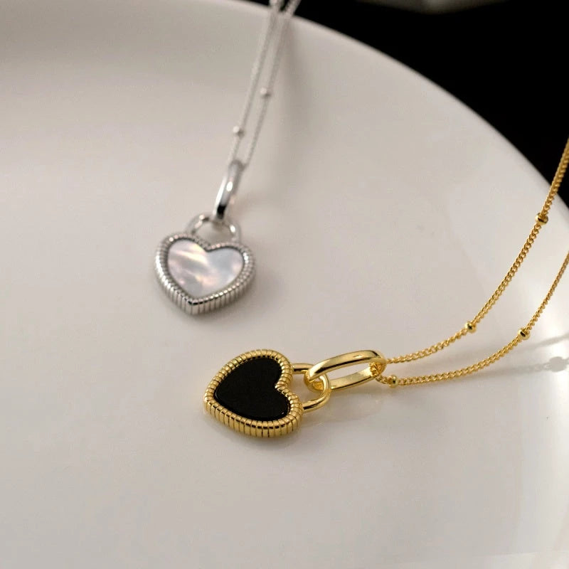 Sterling Silver Luxury White And Balck Heart-Design Necklaces worn to showcase its length and pendant detail