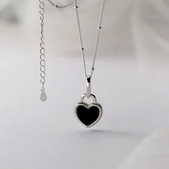 Detailed view of the Sterling Silver Luxury White And Balck Heart-Design Necklaces chain and pendant
