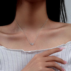 Close-up of the pendant and clasp on the Moon Heart Necklace