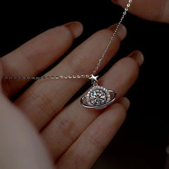 Close-up of the pendant and clasp on the Planet Moissanite Necklace