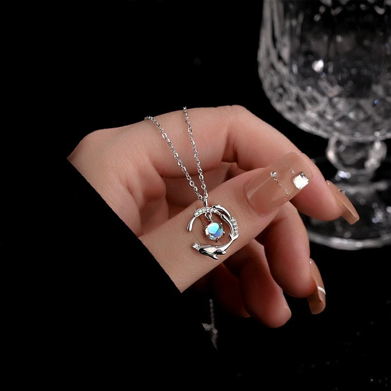 Close-up of the pendant and clasp on the Whale Tail Necklace