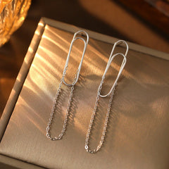Close-up detail of the sparkling zircons and plating on the Paper Clip Tassel Earrings