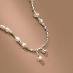 Close-up of the pendant and clasp on the Pearl Heart Necklace